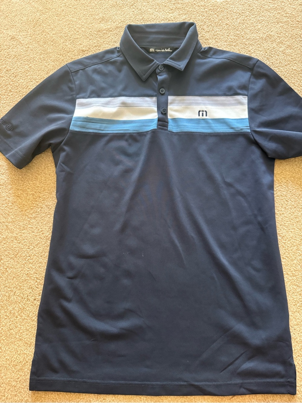Travis Mathew Navy Polo with White and Light Blue Chest Stripes